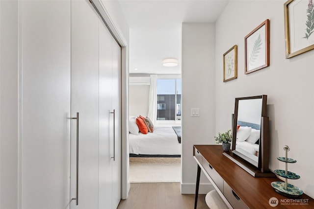 4303 Dayton Ave N Unit E, Seattle, WA 98103 - hall with wood finished floors and a wall unit AC