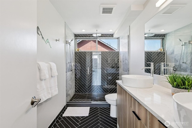 4303 Dayton Ave N Unit E, Seattle, WA 98103 - full bath with double vanity, a stall shower, plenty of natural light, and recessed lighting