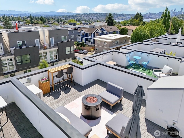 4303 Dayton Ave N Unit E, Seattle, WA 98103 - view of patio with a mountain view and a residential view