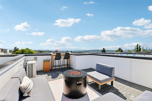 4303 Dayton Ave N Unit E, Seattle, WA 98103 - view of patio featuring an outdoor fire pit