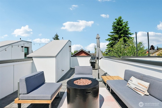 4303 Dayton Ave N Unit E, Seattle, WA 98103 - view of patio / terrace with an outdoor fire pit