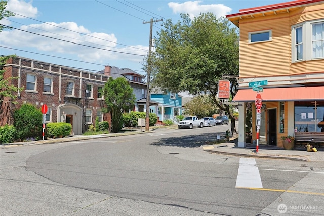 4303 Dayton Ave N Unit E, Seattle, WA 98103 - view of asphalt street with sidewalks, curbs, and traffic signs