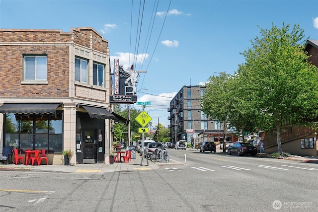 4303 Dayton Ave N Unit E, Seattle, WA 98103 - view of asphalt street with curbs, sidewalks, street lighting, and traffic signs