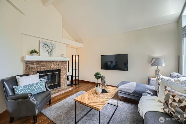 34427 10th Ave SW, Federal Way, WA 98023 - living room with a brick fireplace, wood finished floors, beam ceiling, and high vaulted ceiling
