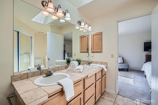 34427 10th Ave SW, Federal Way, WA 98023 - ensuite bathroom featuring double vanity, a chandelier, and tile patterned flooring