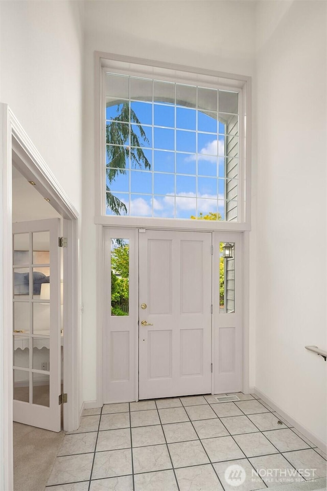 8612 218th St SW, Edmonds, WA 98026 - entryway with a towering ceiling and light tile patterned floors