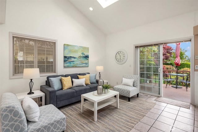 8612 218th St SW, Edmonds, WA 98026 - living area with high vaulted ceiling, light tile patterned flooring, a skylight, and recessed lighting