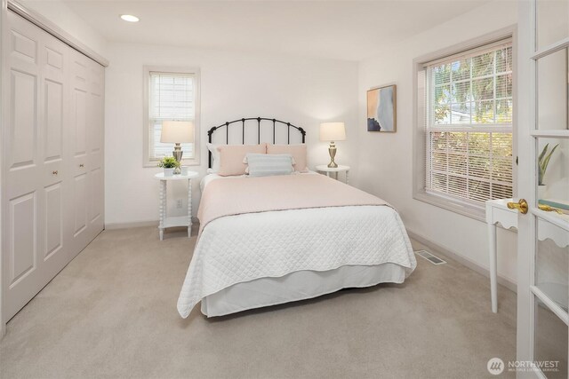 8612 218th St SW, Edmonds, WA 98026 - bedroom featuring light colored carpet, a closet, and recessed lighting