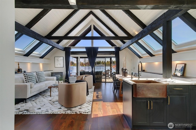 2822 Boyer Ave E Unit 11, Seattle, WA 98102 - living area featuring a skylight, beam ceiling, wood finished floors, and high vaulted ceiling