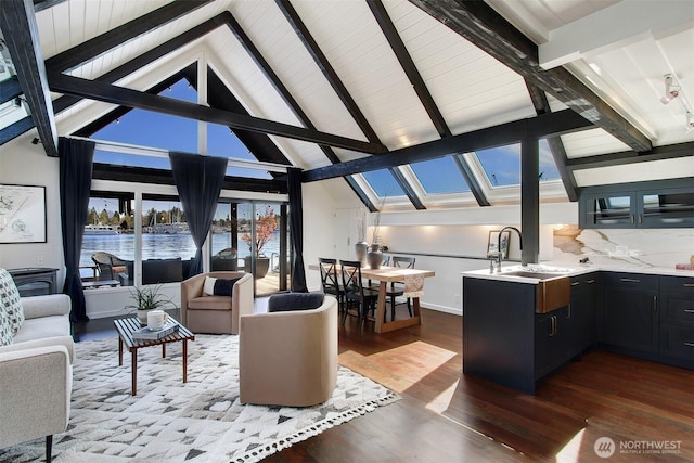 2822 Boyer Ave E Unit 11, Seattle, WA 98102 - living area with a skylight, dark wood-style flooring, healthy amount of natural light, beam ceiling, and a water view