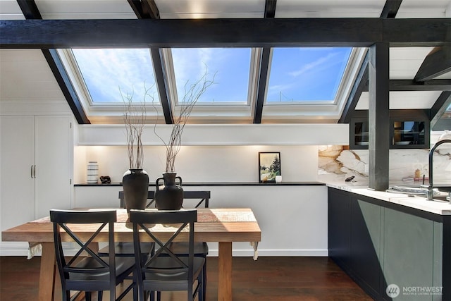 2822 Boyer Ave E Unit 11, Seattle, WA 98102 - dining area featuring dark wood-type flooring and a skylight