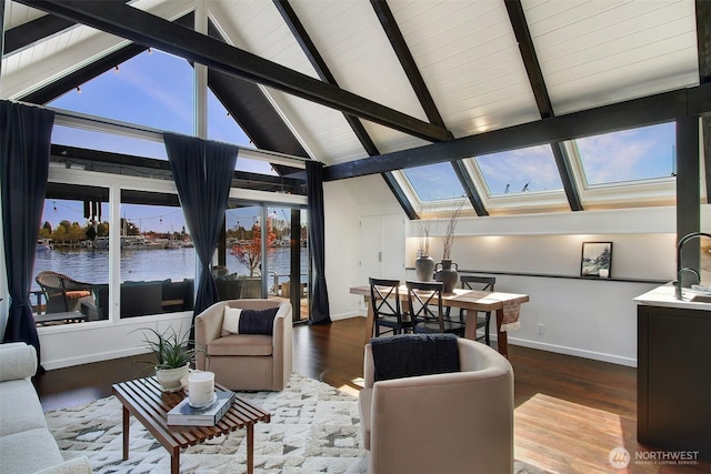 2822 Boyer Ave E Unit 11, Seattle, WA 98102 - living area featuring a skylight, high vaulted ceiling, a water view, wood finished floors, and a wood ceiling with exposed beams