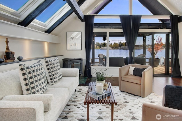 2822 Boyer Ave E Unit 11, Seattle, WA 98102 - living area with a skylight, a water view, a wood stove, and plenty of natural light