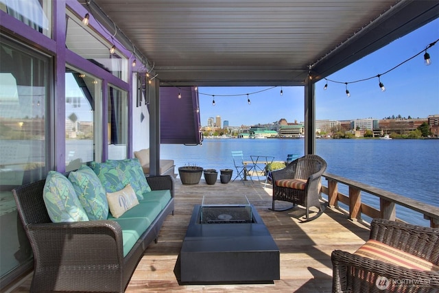 2822 Boyer Ave E Unit 11, Seattle, WA 98102 - view of patio / terrace with a water view and an outdoor living space with a fire pit