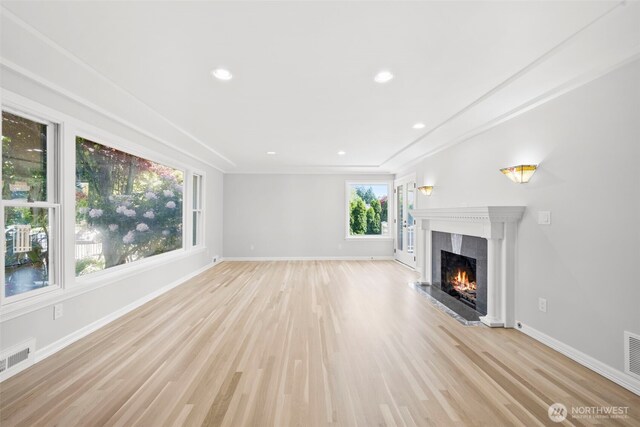 3505 W 43rd Ave, Seattle, WA 98199 - unfurnished living room with a fireplace, light wood-type flooring, and recessed lighting