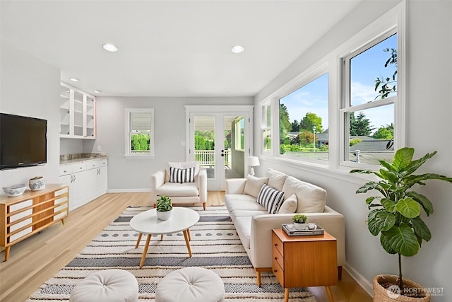 3505 W 43rd Ave, Seattle, WA 98199 - living area with french doors, light wood finished floors, and recessed lighting