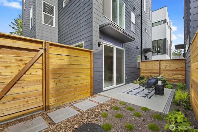 9021A 13th Ave NW, Seattle, WA 98117 - fenced backyard featuring a patio area