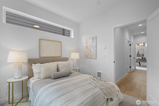 9021A 13th Ave NW, Seattle, WA 98117 - bedroom with wood finished floors and recessed lighting
