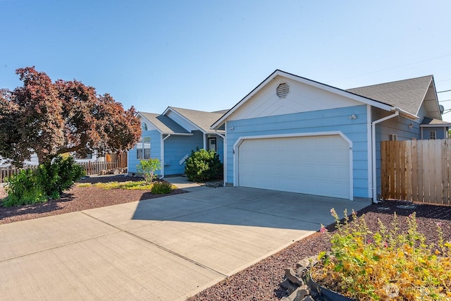 206 E St NE, Ephrata, WA 98823 - ranch-style house featuring an attached garage and concrete driveway