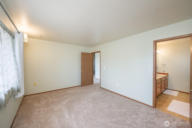 206 E St NE, Ephrata, WA 98823 - unfurnished bedroom with light colored carpet and ensuite bath