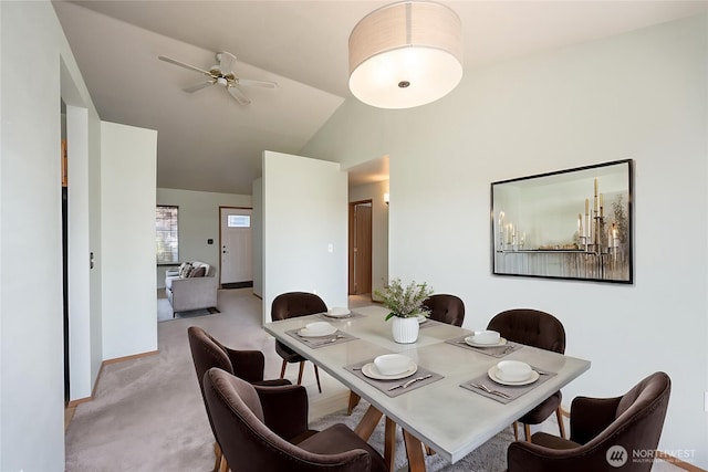 206 E St NE, Ephrata, WA 98823 - dining room with a ceiling fan, light carpet, and high vaulted ceiling