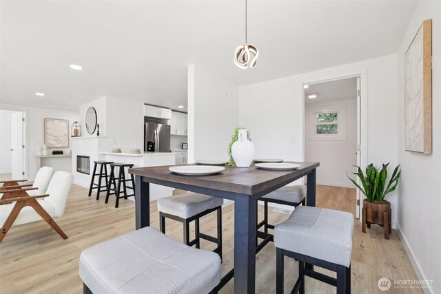 12448 Occidental Ave S, Seattle, WA 98168 - dining area with light wood-style floors and recessed lighting