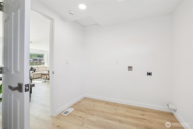 12448 Occidental Ave S, Seattle, WA 98168 - washroom featuring hookup for an electric dryer and light wood finished floors