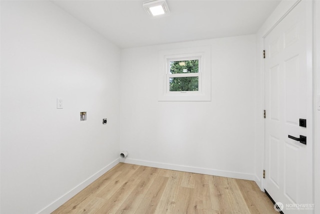 12448 Occidental Ave S, Seattle, WA 98168 - laundry room featuring electric dryer hookup, light wood finished floors, and hookup for a washing machine