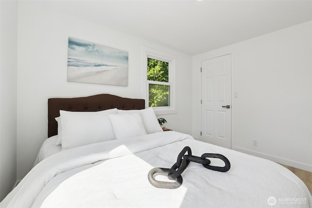 12448 Occidental Ave S, Seattle, WA 98168 - bedroom featuring wood finished floors and baseboards