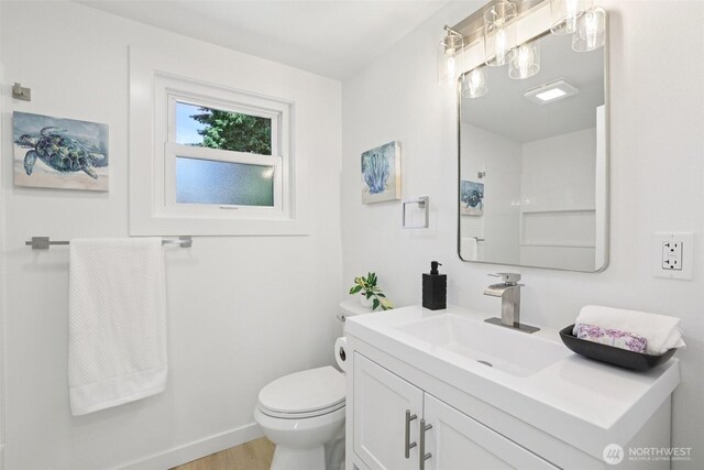 12448 Occidental Ave S, Seattle, WA 98168 - bathroom with vanity and wood finished floors