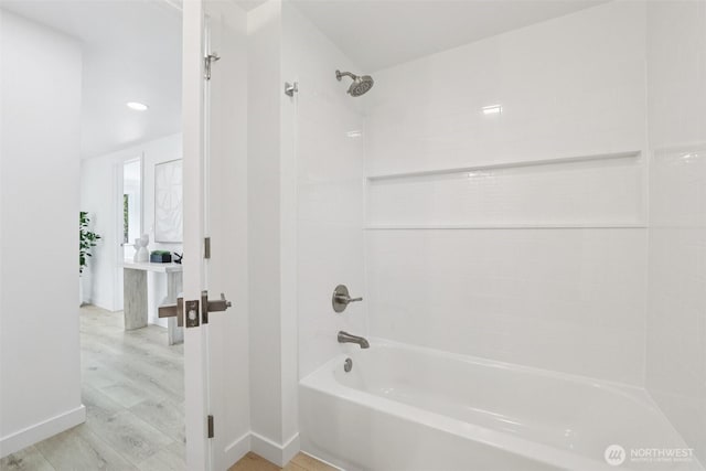 12448 Occidental Ave S, Seattle, WA 98168 - bathroom featuring shower / tub combination and wood finished floors