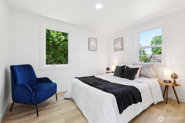 12448 Occidental Ave S, Seattle, WA 98168 - bedroom featuring multiple windows, light wood-type flooring, and recessed lighting