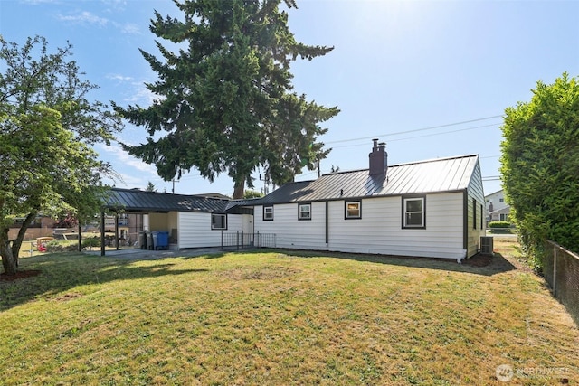 12448 Occidental Ave S, Seattle, WA 98168 - rear view of property featuring a chimney, a metal roof, and a standing seam roof