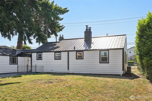 12448 Occidental Ave S, Seattle, WA 98168 - rear view of house with a chimney, a standing seam roof, and a metal roof