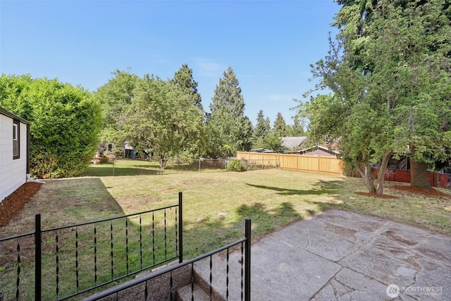 12448 Occidental Ave S, Seattle, WA 98168 - fenced backyard featuring a patio area