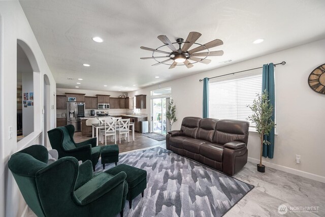 4211 W Heaverlo Dr, Moses Lake, WA 98837 - living room with recessed lighting, arched walkways, and ceiling fan
