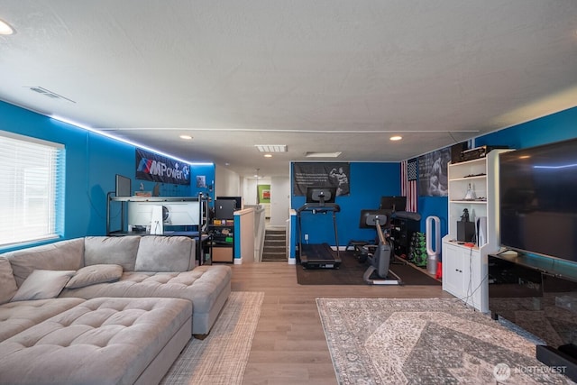 4211 W Heaverlo Dr, Moses Lake, WA 98837 - living area with wood finished floors, recessed lighting, and stairway