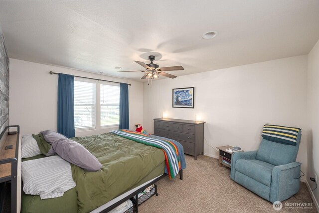4211 W Heaverlo Dr, Moses Lake, WA 98837 - bedroom featuring light carpet and a ceiling fan