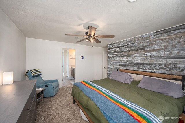 4211 W Heaverlo Dr, Moses Lake, WA 98837 - bedroom featuring an accent wall, carpet flooring, ensuite bath, and a ceiling fan