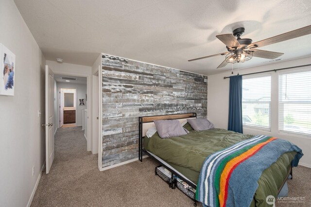 4211 W Heaverlo Dr, Moses Lake, WA 98837 - bedroom featuring carpet flooring, an accent wall, and ceiling fan