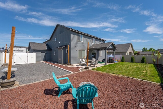 4211 W Heaverlo Dr, Moses Lake, WA 98837 - back of house featuring a gate, a fenced backyard, and a patio