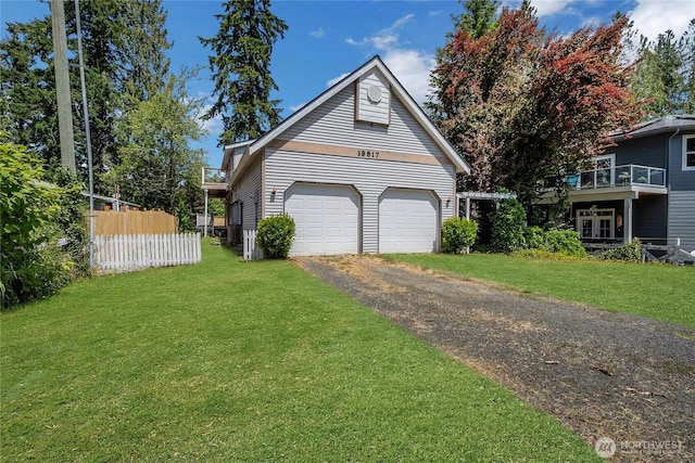 19517 Whiteman Cove Rd SW, Longbranch, WA 98351 - view of home's exterior featuring a garage and asphalt driveway