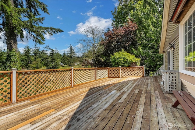 19517 Whiteman Cove Rd SW, Longbranch, WA 98351 - wooden deck featuring view of scattered trees