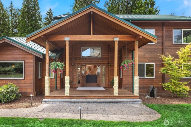 7717 252nd Ave NE, Redmond, WA 98053 - entrance to property with a porch, a standing seam roof, and a metal roof