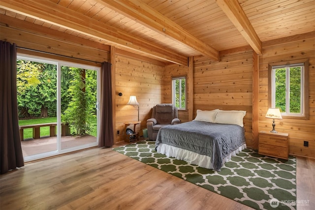 7717 252nd Ave NE, Redmond, WA 98053 - bedroom with access to outside, wood finished floors, a wooden ceiling with exposed beams, and wood walls