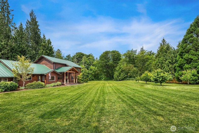 7717 252nd Ave NE, Redmond, WA 98053 - view of grassy yard with covered porch