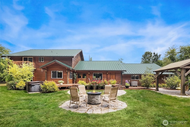 7717 252nd Ave NE, Redmond, WA 98053 - back of house featuring a fire pit, a yard, a gazebo, and a metal roof