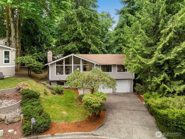 14913 SE 47th Ct, Bellevue, WA 98006 - view of front of property with a chimney, an attached garage, and driveway