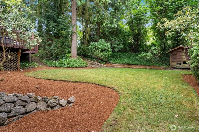 14913 SE 47th Ct, Bellevue, WA 98006 - view of green lawn featuring a storage unit and a deck