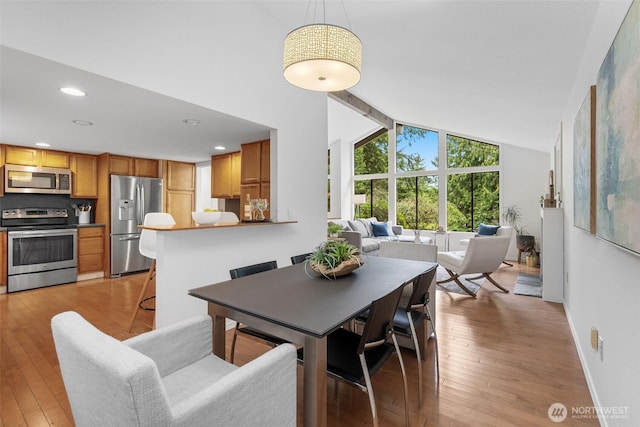 14913 SE 47th Ct, Bellevue, WA 98006 - dining room with light wood-type flooring, recessed lighting, and high vaulted ceiling